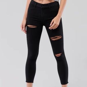 Black ripped low rise skinny jeans.